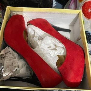 Red suede pumps